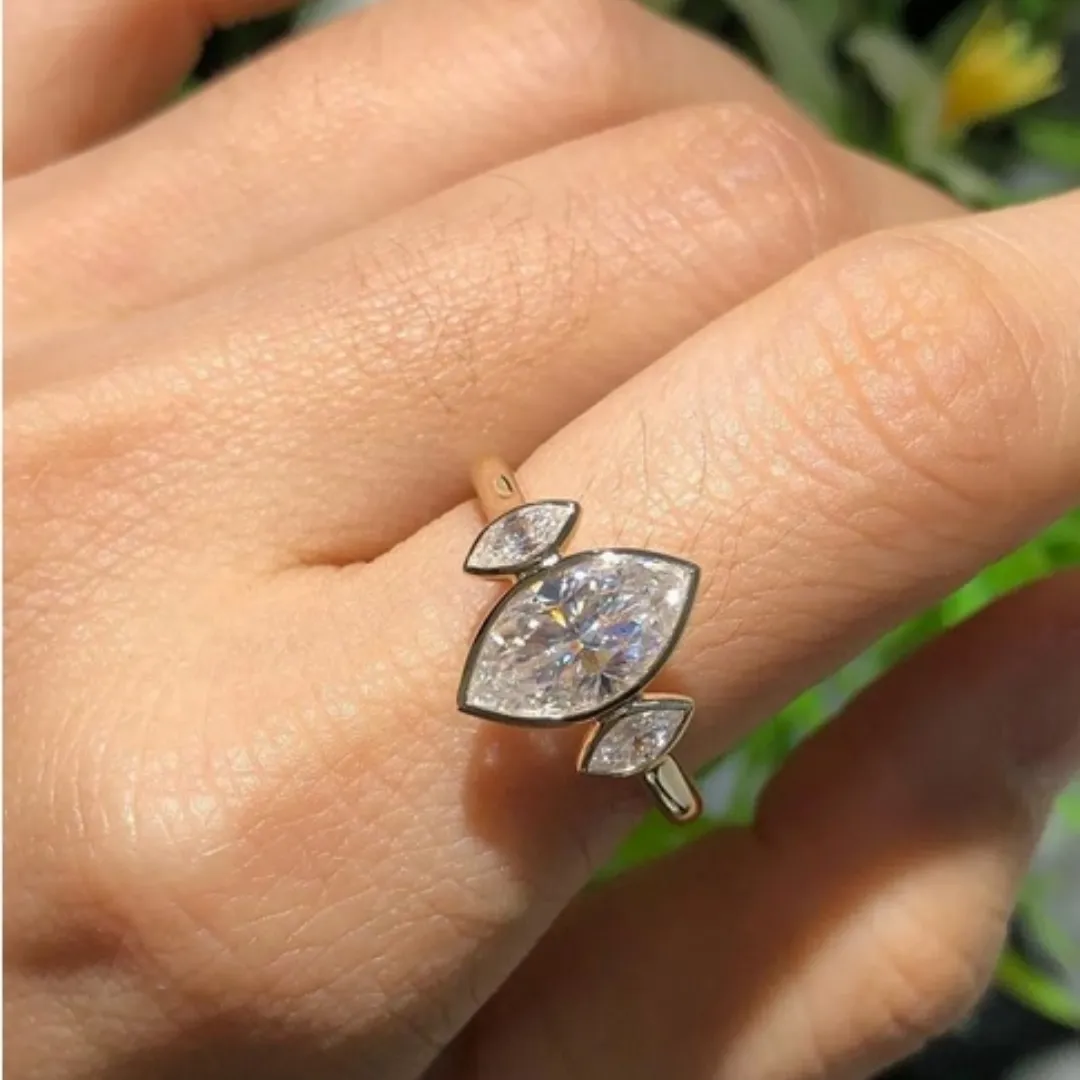 /public/photos/live/Marquise Moissanite Trio Engagement Ring (2).webp